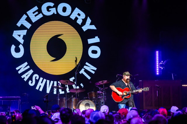 Luke plays his acoustic guitar alone onstage without the band.