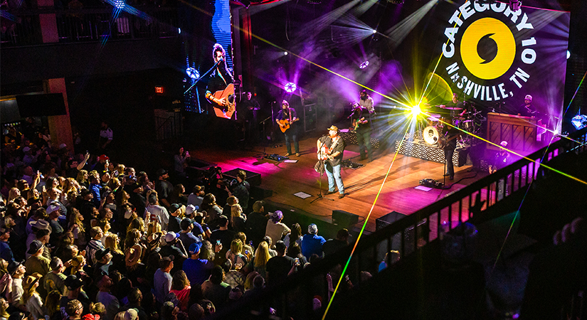 Luke Combs on stage at Hurricane Hall inside Category 10