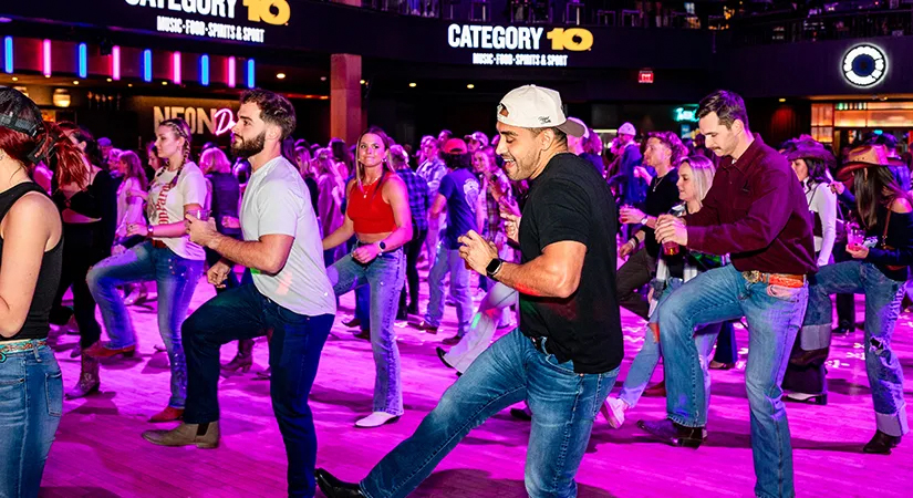 Crowd line dancing at Category 10